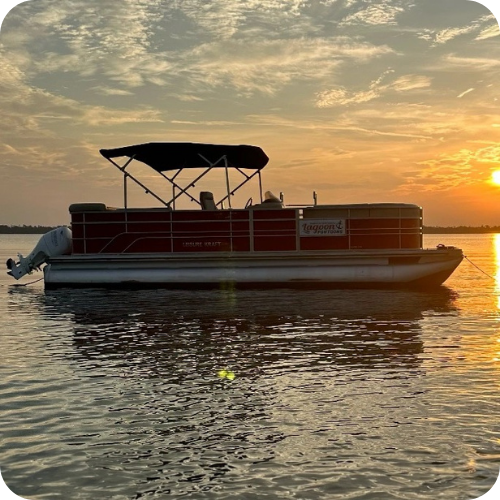 a close up of a boat next to a body of water