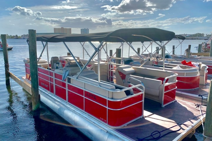 a boat is docked next to a body of water