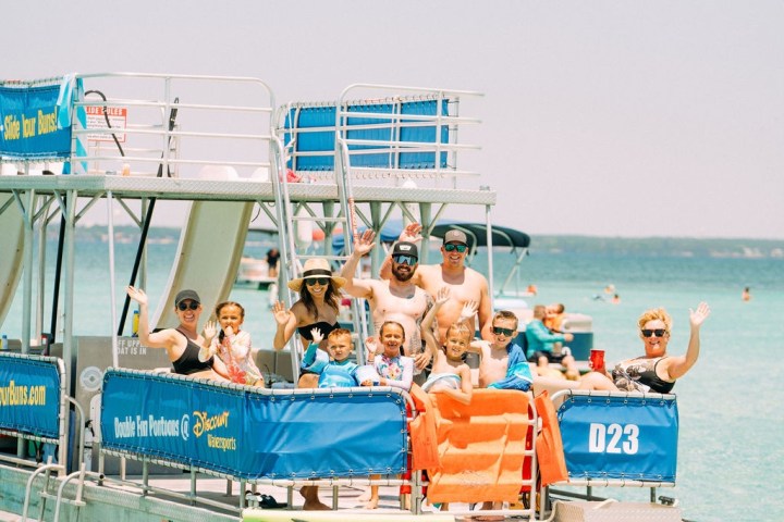 a group of people riding on the back of a boat