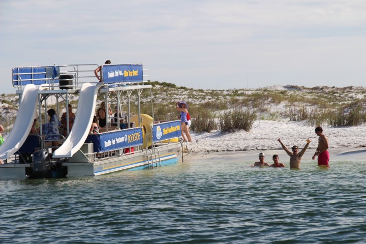 a group of people on a boat in the water