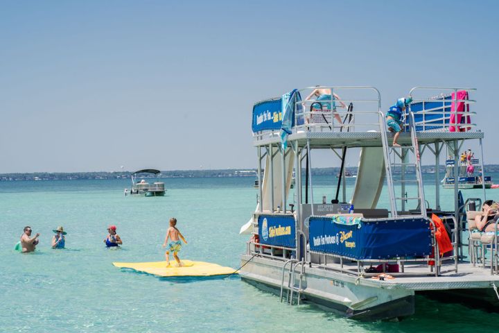 a group of people on a boat in the water