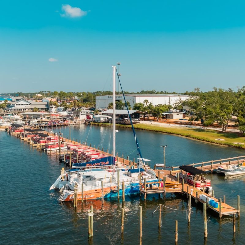 a boat is docked next to a body of water