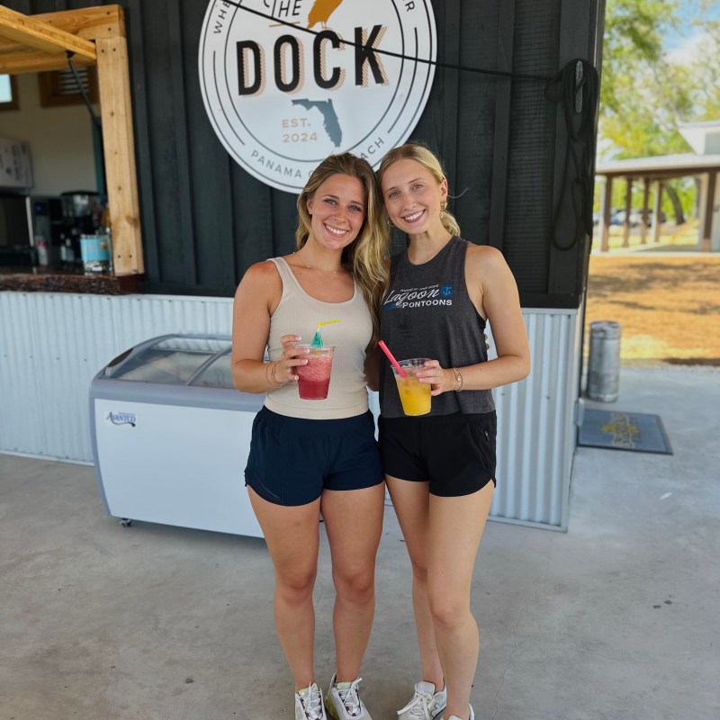 a woman posing in front of a building