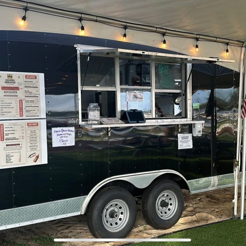 a truck is parked in front of a store