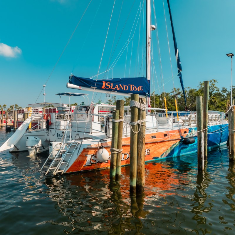a boat is docked next to a body of water