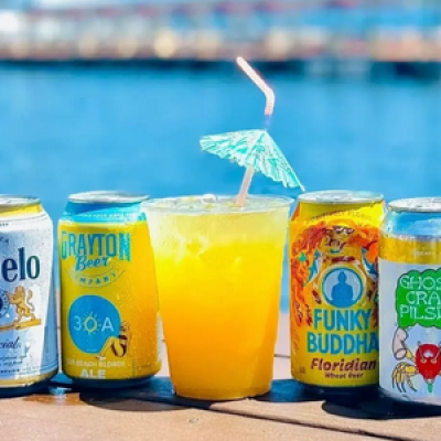 a plastic water bottle next to a cup of coffee