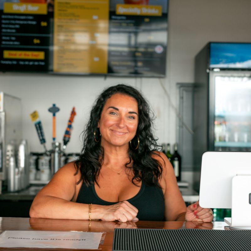 a woman sitting on a table
